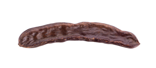 Ripe carob pods and bean isolated on white background.