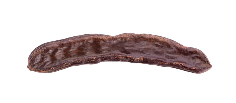 Ripe carob pods and bean isolated on white background.