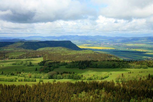 Spring Stolowe Mountain range- landscape near small, picturesque Pasterka village in Poland. Famous tourist attraction. Oldest mountains in Europe. View from Szczeliniec Wielki, Great Szczeliniec.