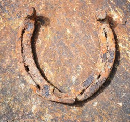 old rusty horseshoe jn  a stone