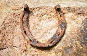 old rusty horseshoe on the beach