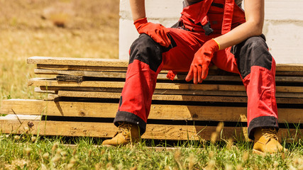 Person wearing red worker trousers