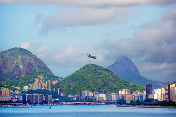 Rio de Janeiro, Brazil, city view from the sea. The plane is flying over the city.
 The main airport serving the Brazilian city of Rio de Janeiro is located 20 kilometers from the city center. Sugarlo