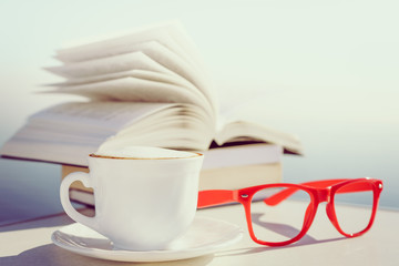 Coffee cup and book outdoor