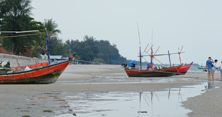 Fishing boat on sand beach