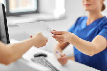 medicine, people and healthcare concept - close up of female doctor or nurse and patient with...
