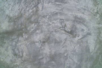 Raw cement wall in loft style. Grunge gray background.