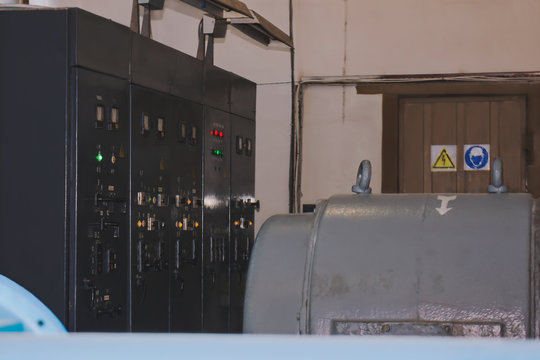 Old outdated equipment control panel in an old production room.