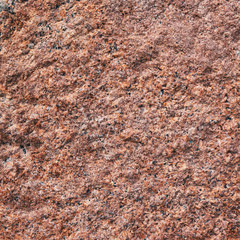 Background granite is a red stone with small black and white spots on the entire surface.