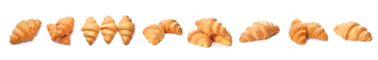 Fresh tasty croissants on white background