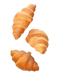 Flying croissants on white background