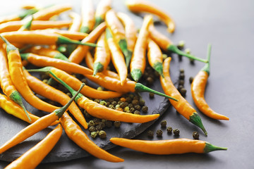 Hot orange pepper. Chilean pepper on a black.