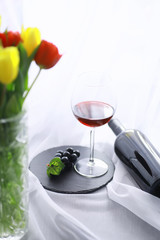 Glass with grape red semi-dry wine. Valentine's day concept background. Gift for the holiday. Sweet sparkling wine.