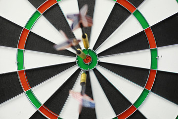 Darts. The dart for playing in the game board is stuck. Hit the sector in darts. The concept of a successful strategy.