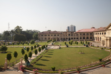New Delhi, Delhi/India- May 20 2020: Fresh green grass of the empty garden park with some trees.