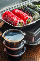 sushi rolls in a plastic thermo container