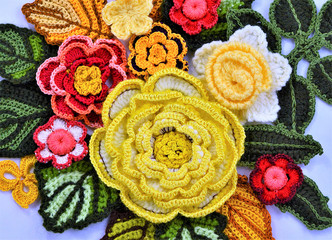 Handmade flowers in different sizes close up, floral background. 