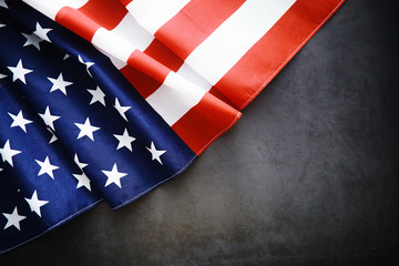 Flapping flag USA with wave. American flag for Memorial Day or 4th of July. Closeup of American flag dark background © alexkich