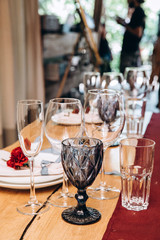 Wedding table decoration. Glasses and candles.