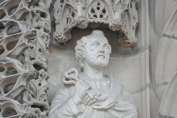 ALBI, FRANCE, EUROPE, SPRING 2019. Biblical sculpture at the entrance of the Cathedral Basilica of Saint Cecilia or the Catholic Basilica of Saint Cécile of red brick is a Gothic masterpiece