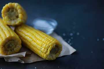Freshly made fragrant ear of corn with salt. Farm snack of fresh corn. Healthy breakfast and healthy lifestyle concept.