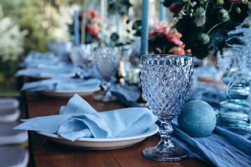 Wedding table decoration. Glasses and candles.