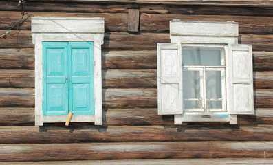 Naklejka na ściany i meble Two windows with wooden shutters
