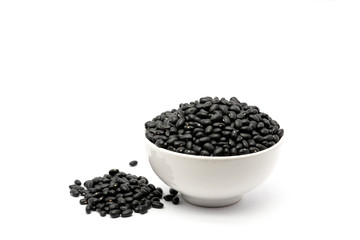 Fototapeta na wymiar Natural black beans in a bowl isolated white background. Black beans providing nutrients vitamins and iron.