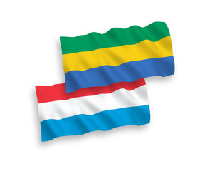 Flags of Gabon and Luxembourg on a white background