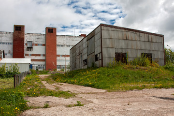 Fototapeta na wymiar The territory of an old beautiful abandoned factory