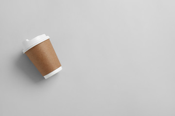 Takeaway cup for drink on light background