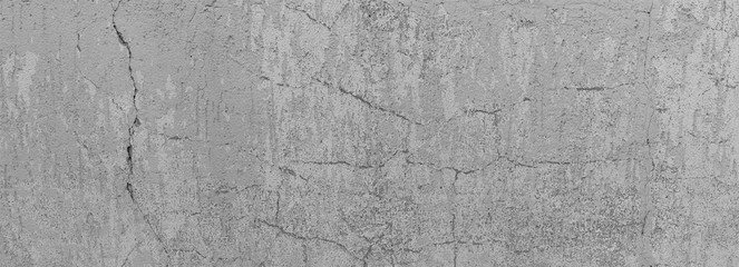 Old stone wall with cracks and abrasions in industrial design as a large banner.