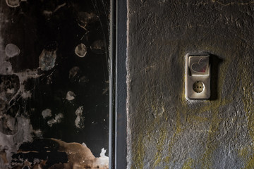 Light switch in a burnt room from an old house