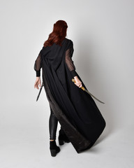 fantasy portrait of a woman with red hair wearing dark leather assassin costume with long black...