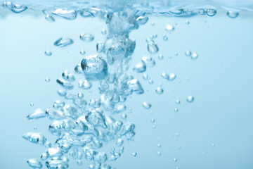 Naklejka na ściany i meble Animated bubbles in clear blue water splash on white background