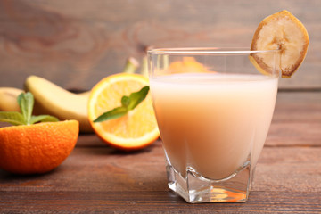 Banana juice in a glass with fruits