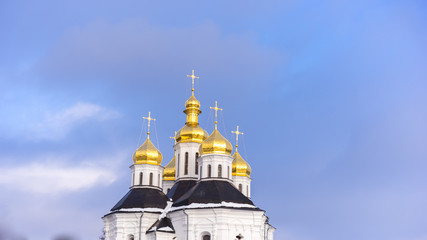 Fototapeta na wymiar An orthodox church in Ukraine, Russia, Eastern European countries, golden domes with crosses, religious building, St. Catherine's Cathedral in Chernigiv, Ukrainian baroque architecture