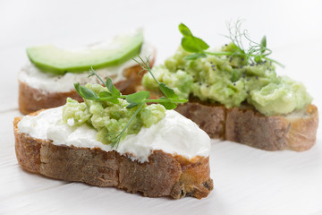 Healthy sandwiches with avocado , cream cheese and micro green. Vegan sandwiches, vegan food, healthy eating , white background, diet food
