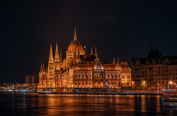 Fototapeta na wymiar Long exposure view of Hungarian Paliament National Assembly by Danube river in the evening