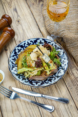 Salad from cheese, cucumber, red onions and lettuce leaves. healthy summer vitamin menu. vegan vegetable food. vegetarian dinner table. top view. flat lay