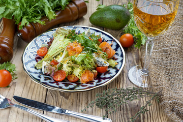 Salad from tomatoes, cucumber, red onions and lettuce leaves. healthy summer vitamin menu. vegan vegetable food. vegetarian dinner table. top view. flat lay