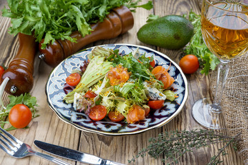 Salad from tomatoes, cucumber, red onions and lettuce leaves. healthy summer vitamin menu. vegan vegetable food. vegetarian dinner table. top view. flat lay