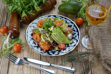 Salad from tomatoes, cucumber, red onions and lettuce leaves. healthy summer vitamin menu. vegan vegetable food. vegetarian dinner table. top view. flat lay