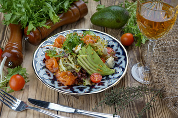 Salad from tomatoes, cucumber, red onions and lettuce leaves. healthy summer vitamin menu. vegan vegetable food. vegetarian dinner table. top view. flat lay