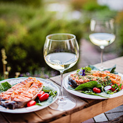 grilled salmon with salad and wine