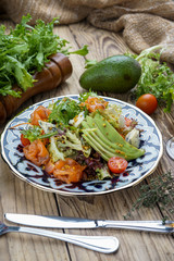 Salad from tomatoes, cucumber, red onions and lettuce leaves. healthy summer vitamin menu. vegan vegetable food. vegetarian dinner table. top view. flat lay