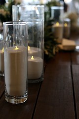 glass of candle on the table