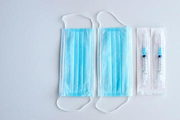 Medical mask and disposable syringe. Medical supplies.
