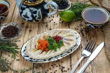 Chickpea hummus in bowl on wooden table