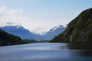 Naklejka na ściany i meble Norwegian fjord with mountains in background, Hardangerfjord 